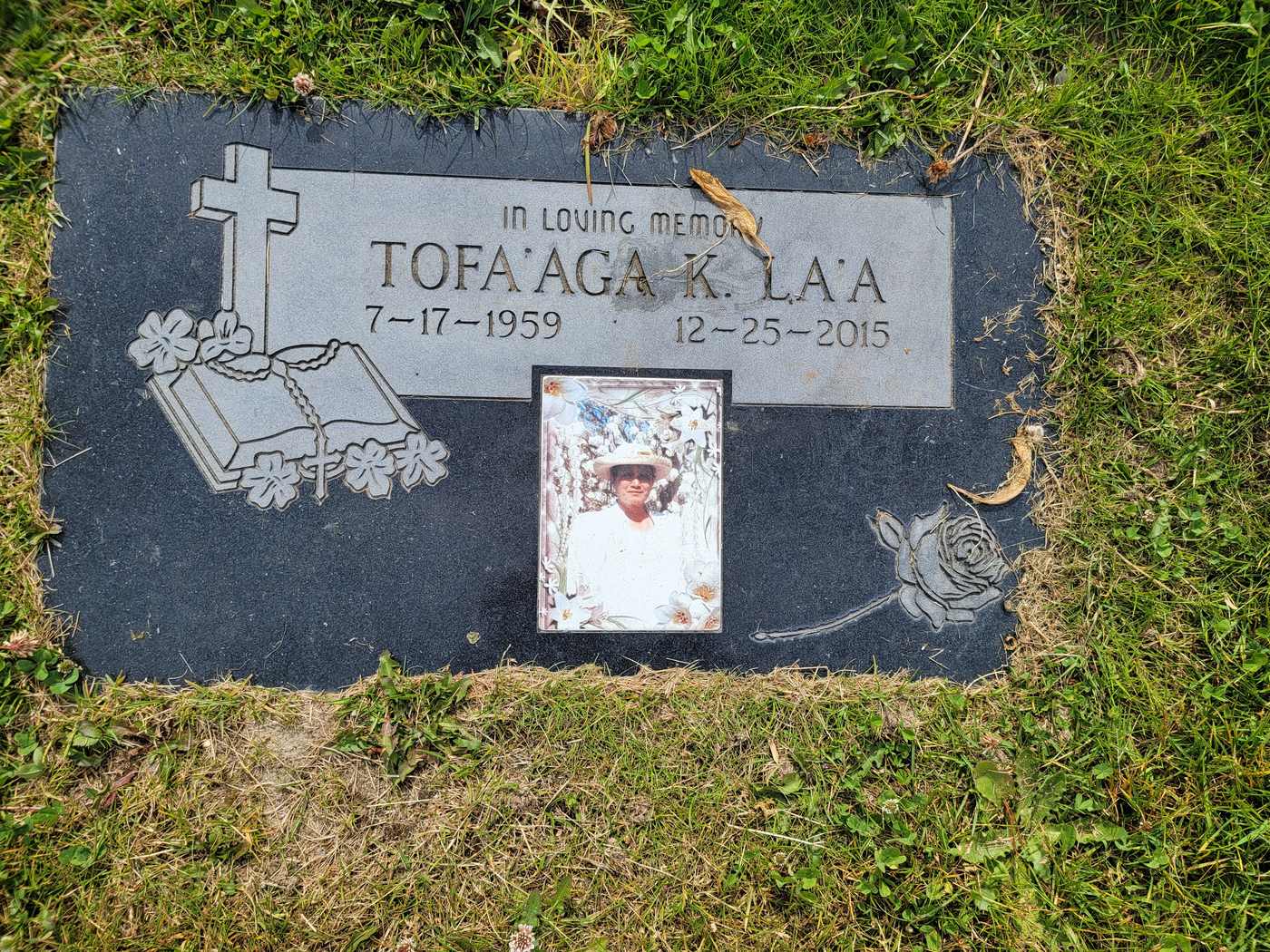 Black granite with etched books, cross and ceramic portrait