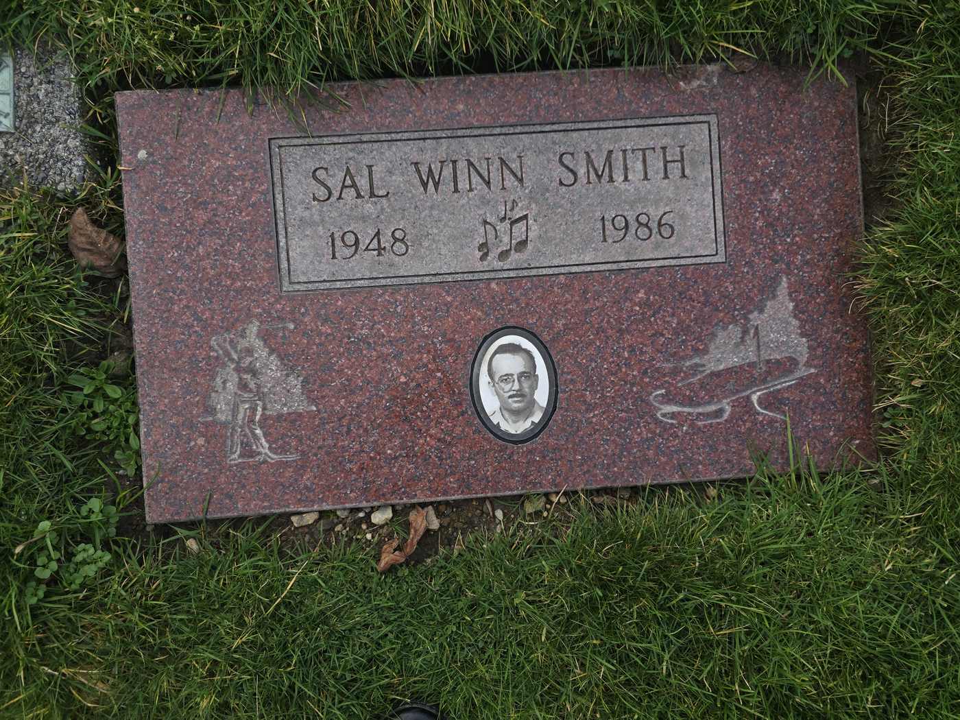 Red granite with an etched portrait medallion