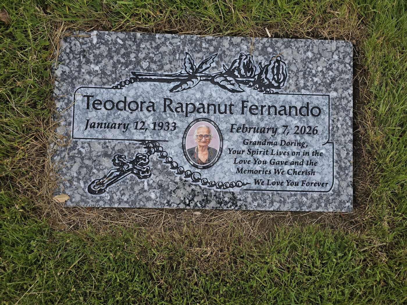 Grey granite with rosary, roses and a color portrait