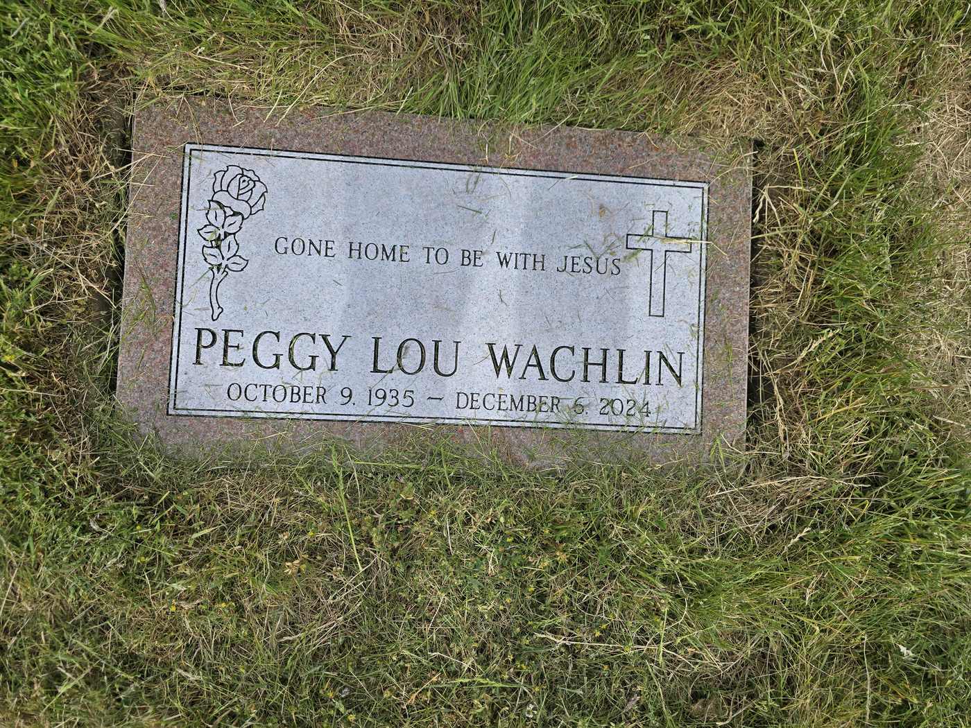Grey granite with an etched rose and cross