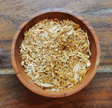 A wooden bowl of sawdust
