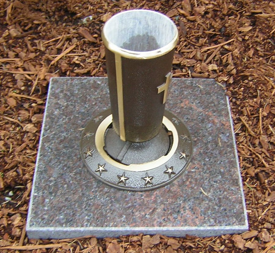 Bronze veterans vase with a star ring set in a granite block